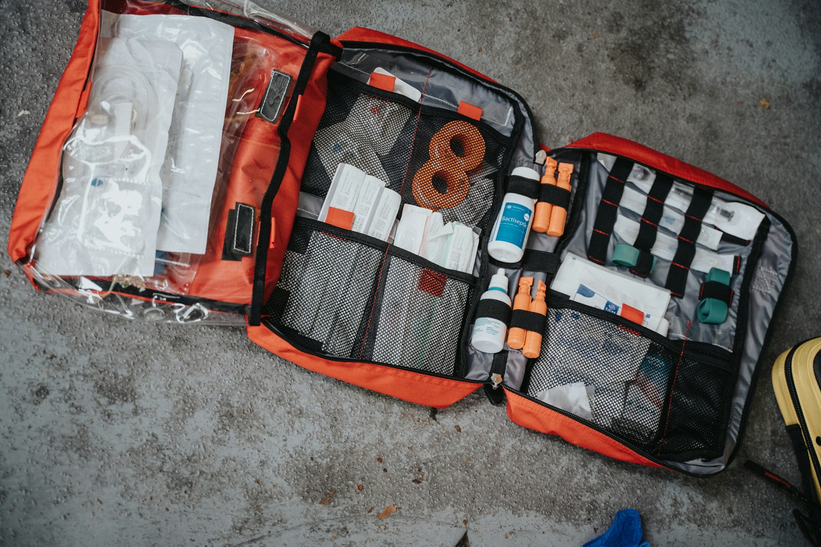 Open medical bag with first-aid and medicine supplies (illustrative photo)
